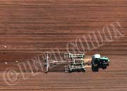image of tractor working te fields