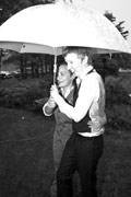 image of happy couple under umbrella