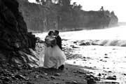 image of bride and groom kissing by the cliffs
