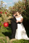 image of wedding couple in apple orchard