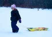 image of girl with sled