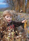 Image of boy by rock wall