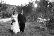 image of couple walking through orchard at Old Orchard Inn