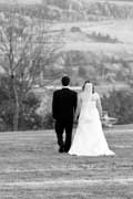 image of wedding couple walking down hill