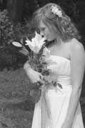 Image of bride smelling flowers 