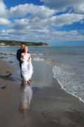 Image of bride and groom on beach